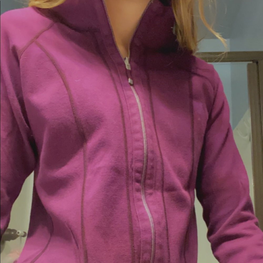 One purple and one blue zip up jacket
